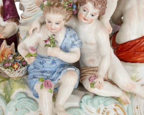 Close up of naked meissen porcelain cherubs on a vase