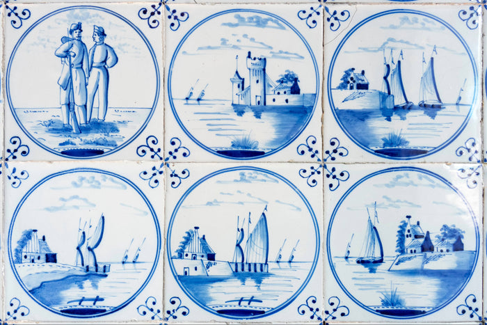 Closeup mural of Delft tiles depicting oriental harbor scene with ships